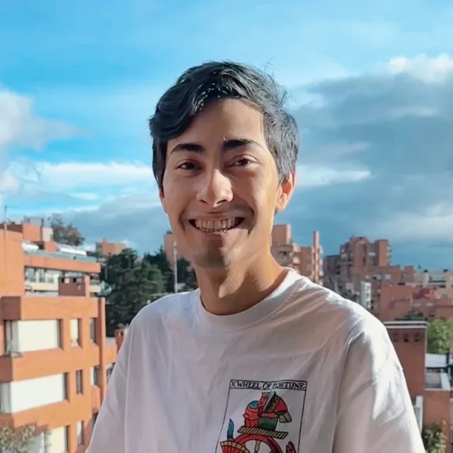 Nicolás Robayo Pardo, smiling, on a rooftop terrace in Bogotá